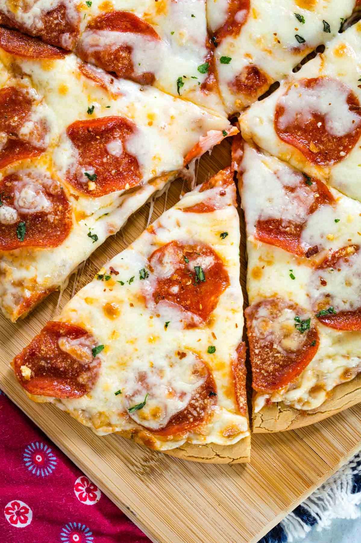  A crispy yet chewy gluten-free crust serves as the perfect foundation for this Pepperoni Pizza Pie.