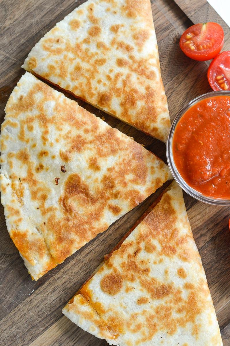 Biting into this warm and gooey quesadilla is like taking a vacation to Italy, but without the gluten-induced stomach ache.