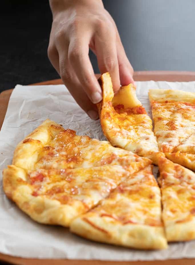  Say goodbye to store-bought pizza base with this quick and easy recipe.