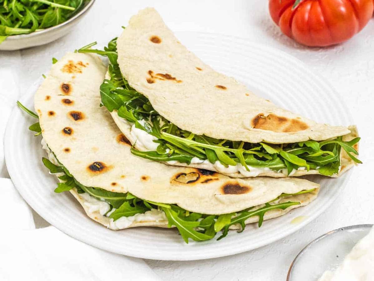  Soft, chewy, and filled with flavor, this piadina is sure to please.