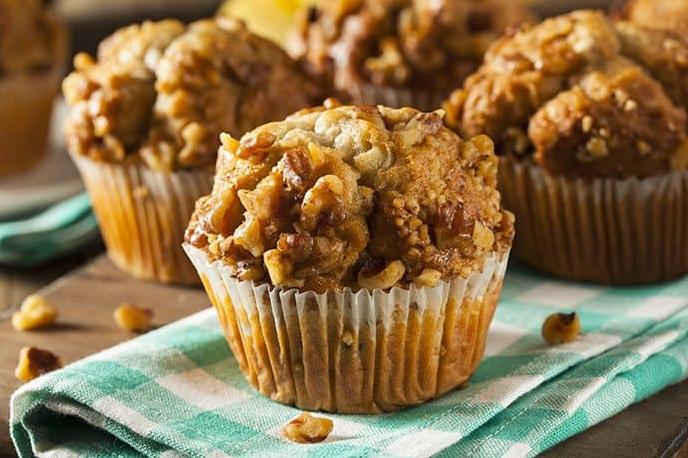  Start your day with a warm, fluffy muffin that's both gluten-free and dairy-free, topped with a sprinkle of oats.