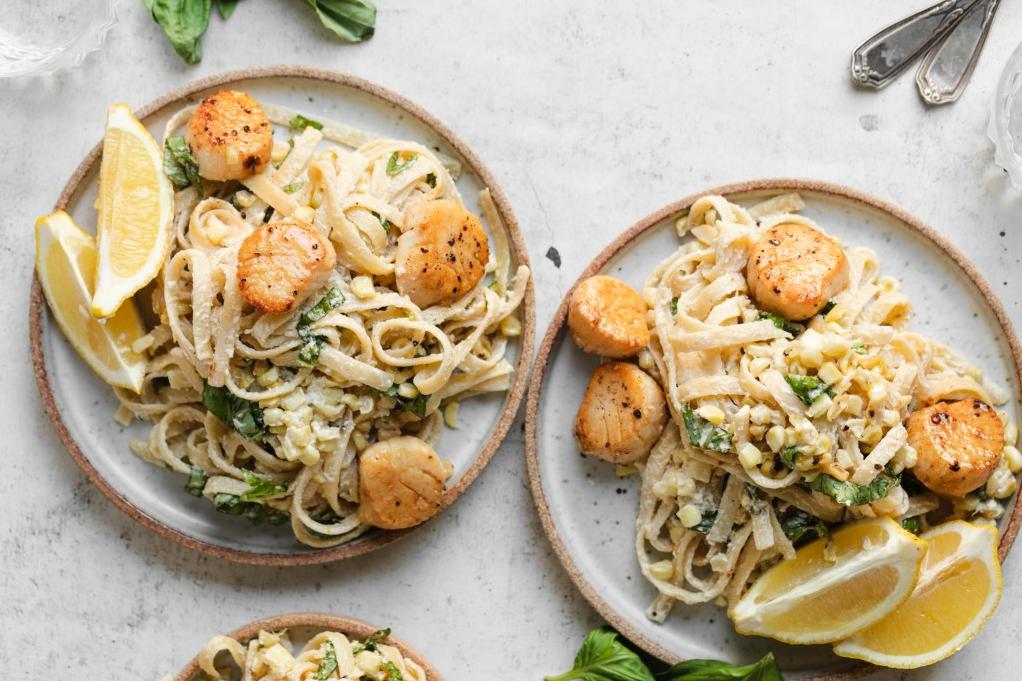  This creamy and aromatic basil sauce pairs perfectly with tender scallops and gluten-free pasta.